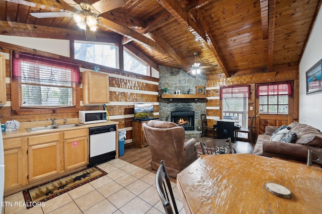 kitchen with beamed ceiling, ceiling fan, a fireplace, white appliances, and wooden ceiling