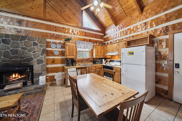 kitchen featuring ceiling fan, a fireplace, white appliances, light tile flooring, and wood ceiling