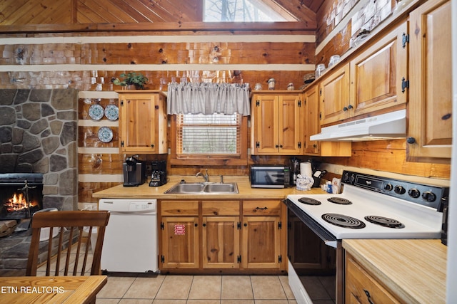 kitchen with light tile floors, a fireplace, sink, white appliances, and wood ceiling