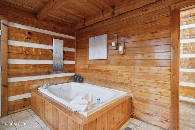 bathroom with tile flooring, wooden ceiling, wood walls, and a bath