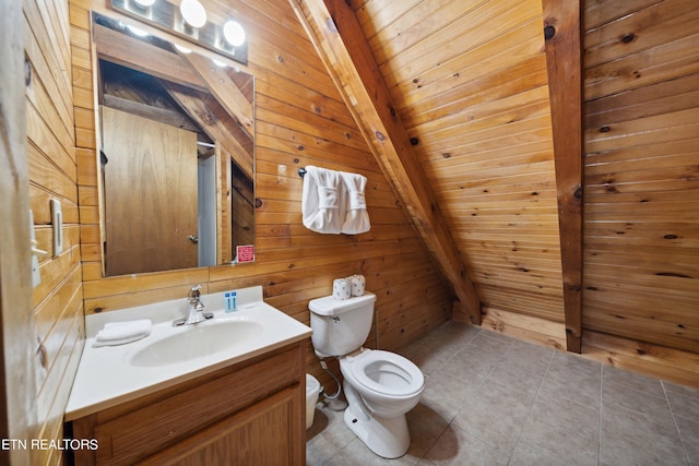 bathroom featuring tile flooring, vaulted ceiling with beams, toilet, and wooden walls