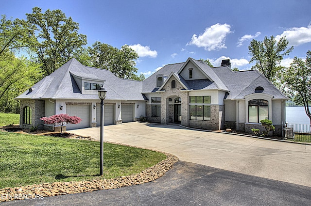 french provincial home with a front lawn