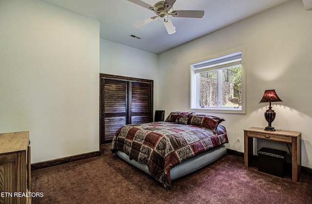 bedroom with dark colored carpet and ceiling fan