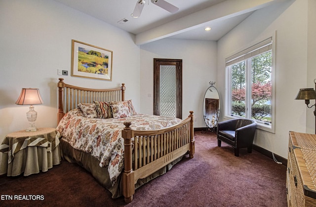 bedroom featuring dark carpet and ceiling fan