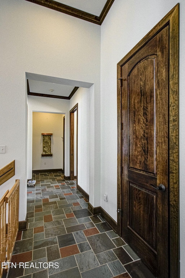 hallway featuring crown molding