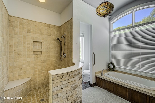 bathroom featuring separate shower and tub and toilet