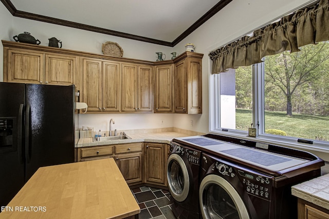 laundry room featuring separate washer and dryer, plenty of natural light, ornamental molding, and sink