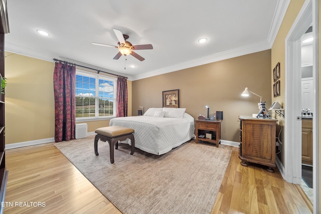 bedroom with light hardwood / wood-style floors, crown molding, and ceiling fan