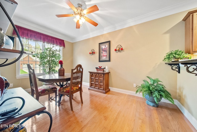 dining area with crown molding, light hardwood / wood-style flooring, and ceiling fan