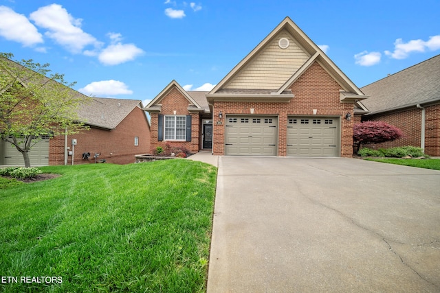 view of front of home featuring a front yard and a garage