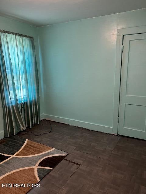 empty room with parquet flooring