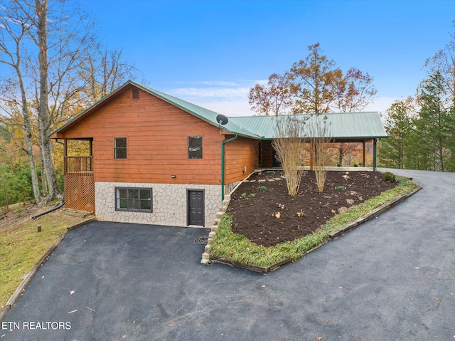 view of side of property featuring a wooden deck