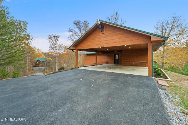 view of home's exterior featuring a carport