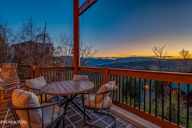 deck at dusk with a mountain view