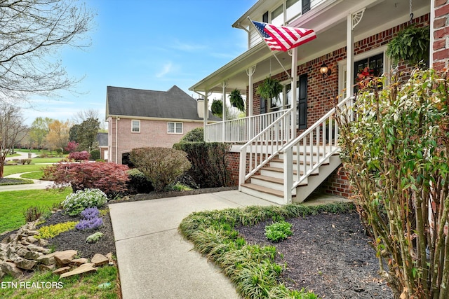 view of side of property featuring a porch