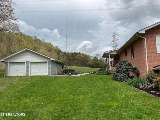 view of yard featuring a garage