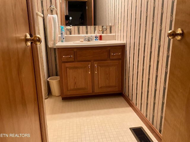 bathroom featuring tile floors and large vanity