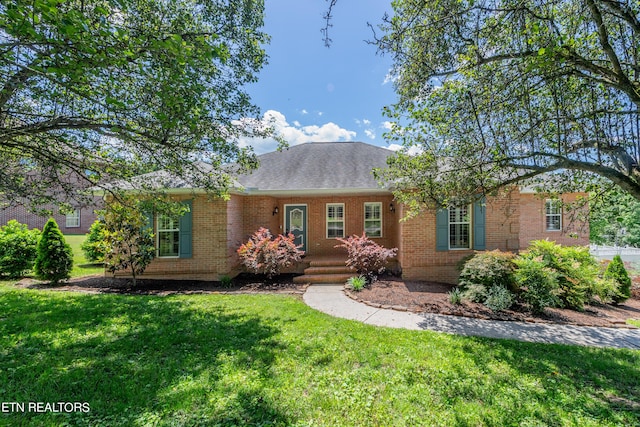 ranch-style home with a front yard