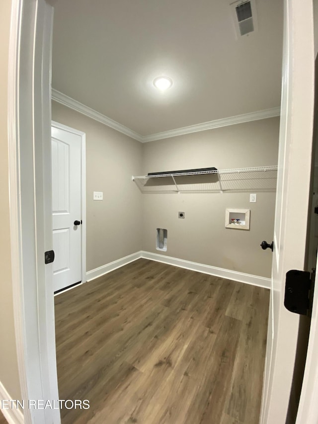 washroom with dark hardwood / wood-style flooring, washer hookup, crown molding, and hookup for an electric dryer