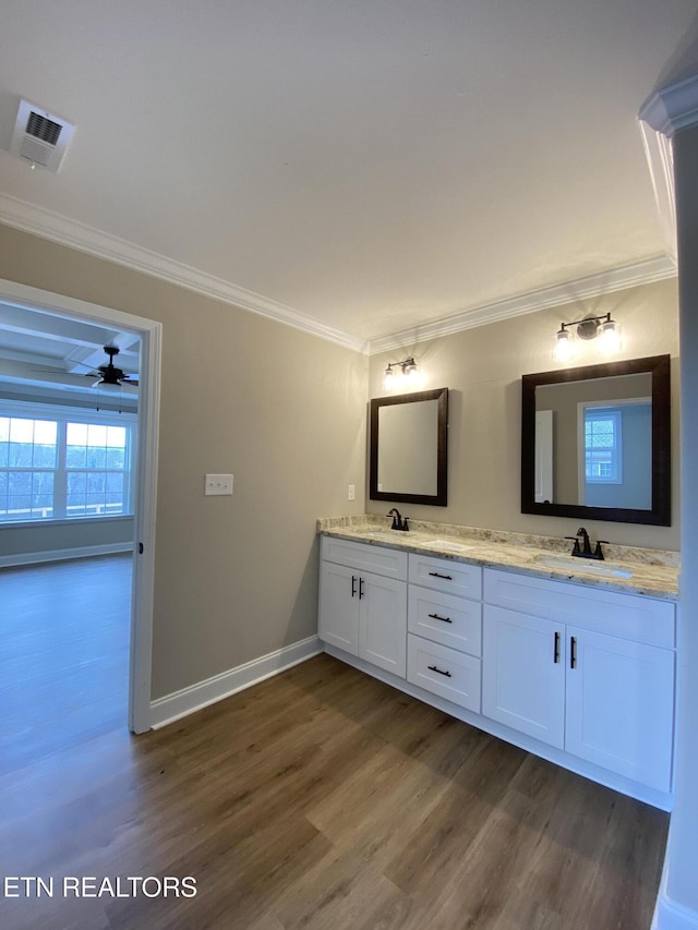 bathroom featuring vanity, ceiling fan, hardwood / wood-style flooring, and crown molding