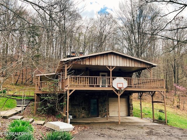 view of front facade with a garage and a deck