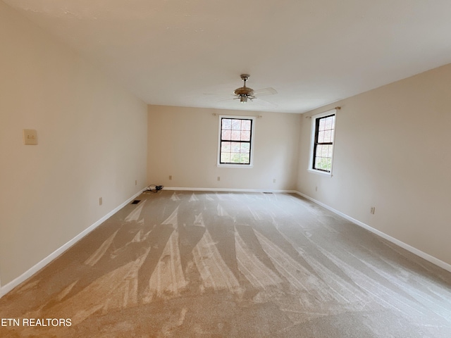 carpeted empty room with ceiling fan