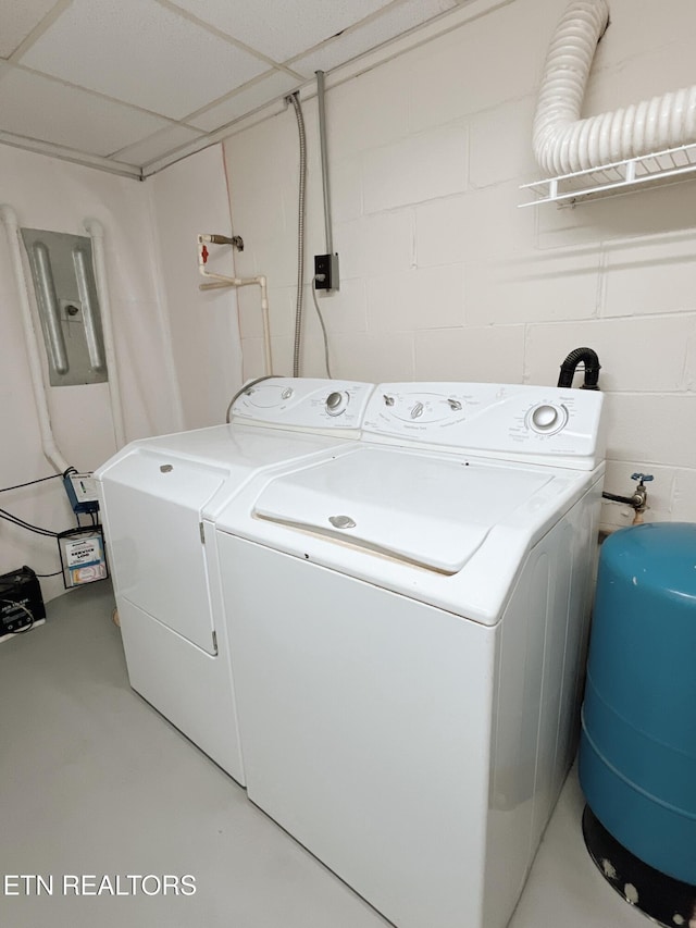 clothes washing area featuring washer and dryer and electric panel