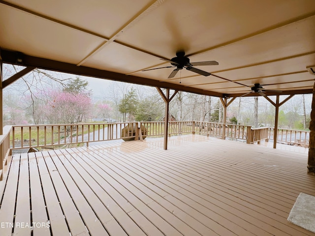 wooden deck featuring ceiling fan