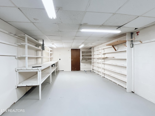 basement featuring a drop ceiling