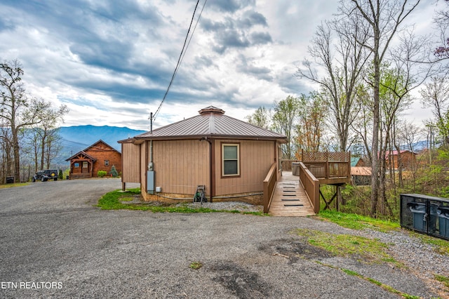 view of front of home with a mountain view