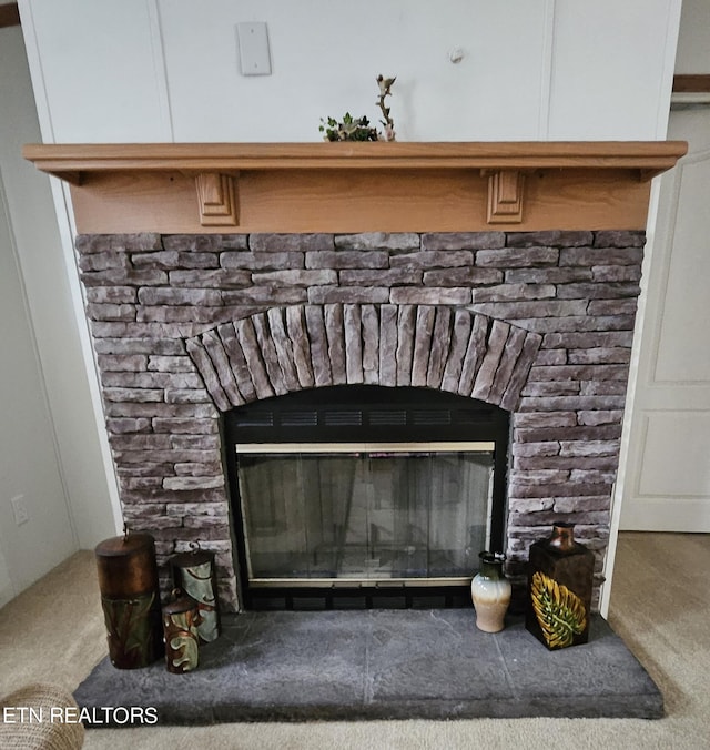 details with carpet and a fireplace