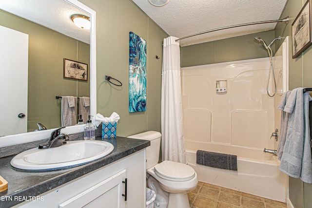 full bathroom featuring oversized vanity, shower / bath combination with curtain, toilet, a textured ceiling, and tile floors