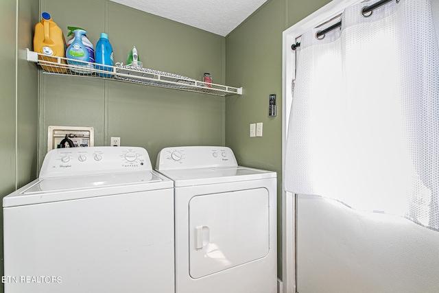 clothes washing area with washer and dryer, washer hookup, and a textured ceiling