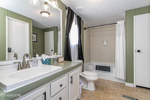 full bathroom with tile floors, vanity, shower / tub combo, and toilet