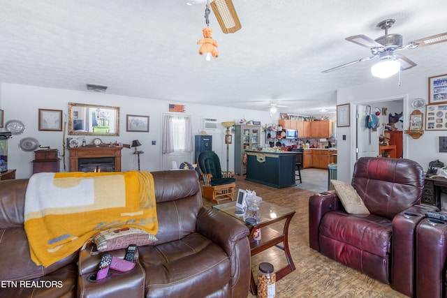 living room featuring light carpet and ceiling fan