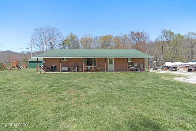 ranch-style home featuring a front yard