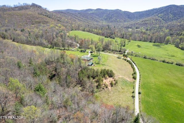 drone / aerial view featuring a rural view and a mountain view