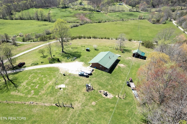 birds eye view of property with a rural view