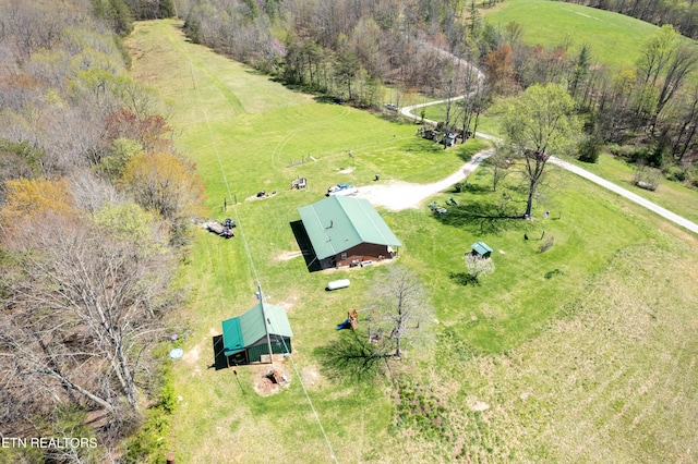 birds eye view of property with a rural view