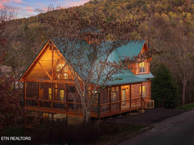 view of front facade featuring a sunroom