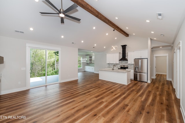 unfurnished living room featuring ceiling fan, high vaulted ceiling, dark hardwood / wood-style flooring, beam ceiling, and a wood stove