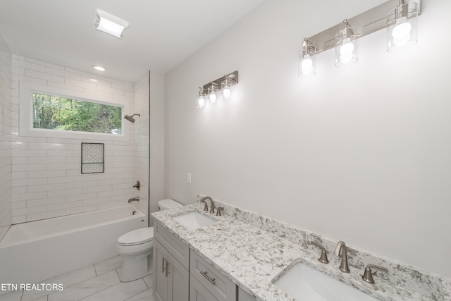 full bathroom with vanity, toilet, and tiled shower / bath combo