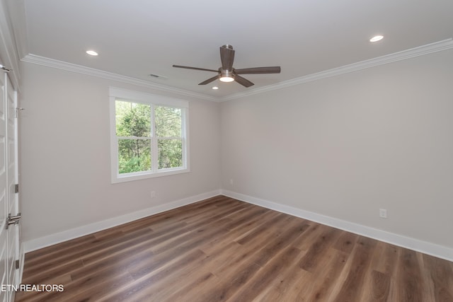 spare room with crown molding, ceiling fan, and dark hardwood / wood-style flooring