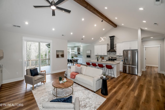 living room featuring beamed ceiling, ceiling fan, dark hardwood / wood-style floors, and high vaulted ceiling