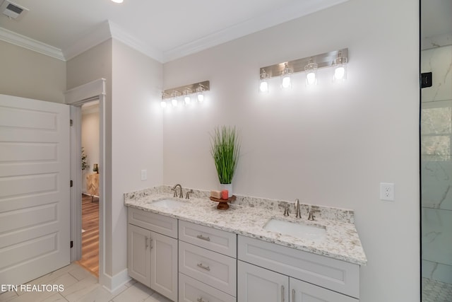 bathroom with vanity and ornamental molding