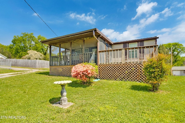 back of house with a yard