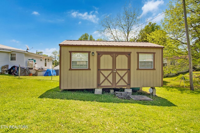 view of shed / structure featuring a yard