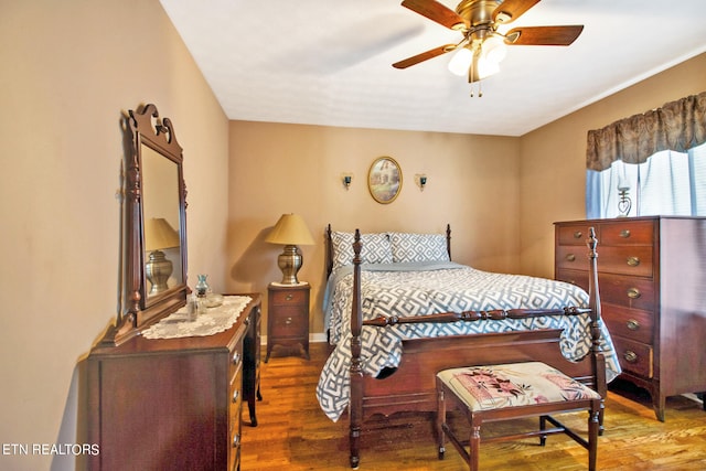 bedroom featuring ceiling fan and dark hardwood / wood-style flooring