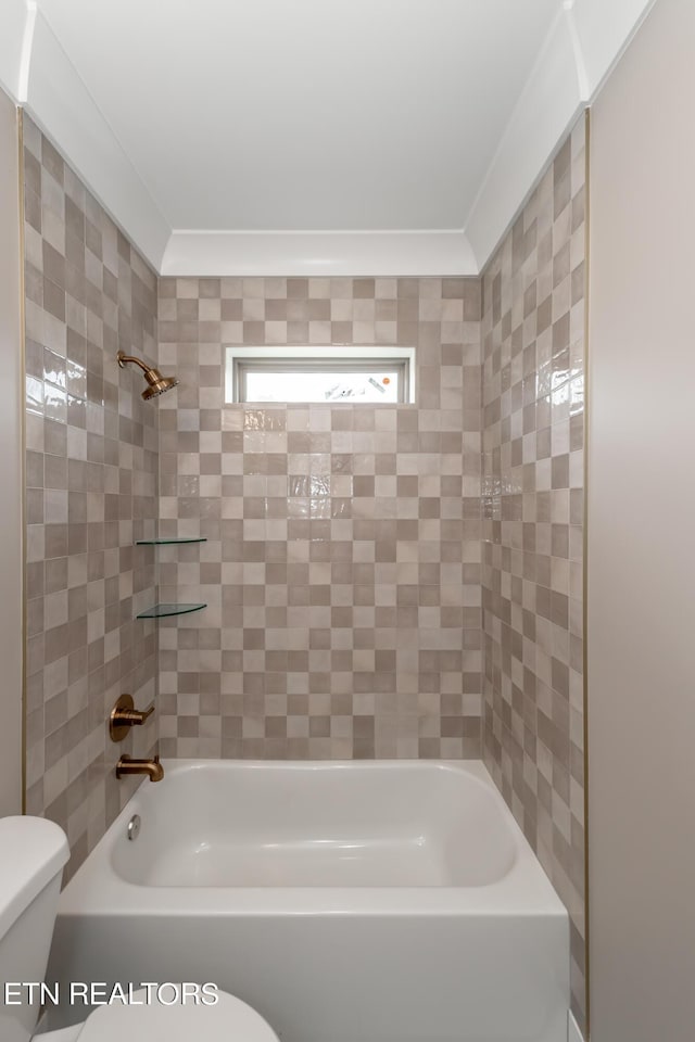 bathroom featuring toilet and bathing tub / shower combination