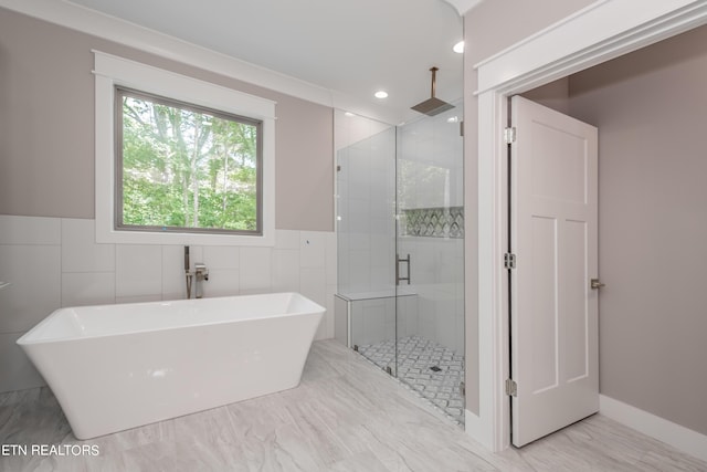 bathroom with independent shower and bath and ornamental molding